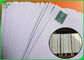 Larghezza bianca su ordinazione del rotolo 75GSM 570MM della carta di Woodfree per la fabbricazione dei libri di scuola
